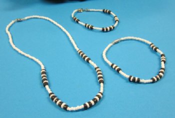 Two tone black and white tiny beads puka shell bracelets measuring 7-1/2 inches. and 9 inches - $4.00 a dozen  