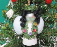 Wholesale Strombus and Cockle shell angel with black hair and green garland necklace ornament - 2-1/2 inches long - Packed: 10 pcs @ $1.60 each; Packed: 30 pcs @ $1.40 each